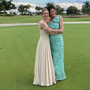 Gown by Teri Jon by Rickie Freeman.  Aqua/silver jacquard, forgiving and comfy